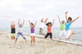 Young people jumping on the beach