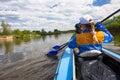 Young people are kayaking on a river in beautiful nature. Summer sunny day Royalty Free Stock Photo