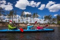 Young people are kayaking on a river in beautiful nature. Summer sunny day Royalty Free Stock Photo