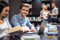 Young people in the library Royalty Free Stock Photo