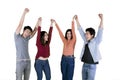 Young people lifting hands together on studio