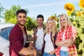 Young people listening guy playing guitar friends drinking beer bottles outdoor countryside Royalty Free Stock Photo