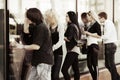 Young people looking through the shop windows Royalty Free Stock Photo