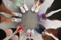 Young people making cle and showing their sports shoes outdoors, above view Royalty Free Stock Photo