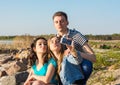 Young people, man and two women, brunette and blonde taking duck