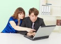 Young people - man and woman working in office Royalty Free Stock Photo