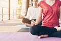 Young people are meditating on colorful tires for good health.