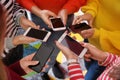 Young people with mobile phones standing in circle. Concept of addiction Royalty Free Stock Photo