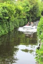 Young people navigate a motor-boat,Loosdrecht, Netherlands Royalty Free Stock Photo