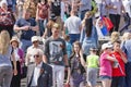 Young people and older people with St. George ribbons in the crowd at the celebration of victory day