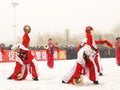 Young people perform Yangge in the snow