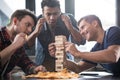 Young people playing jenga game