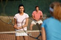 Young people playing mixed doubles