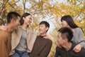 Young people playing piggyback in park Royalty Free Stock Photo