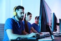 Young people playing video games on computers. Esports tournament Royalty Free Stock Photo