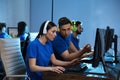 Young people playing video games on computers. Esports tournament Royalty Free Stock Photo