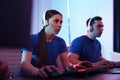 Young people playing video games on computers. Esports tournament Royalty Free Stock Photo