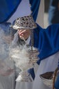 Young people in procession with incense burners in Holy week Royalty Free Stock Photo