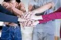 Young people put their hands as a team symbol Royalty Free Stock Photo