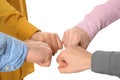 Young people putting their hands together on white, closeup Royalty Free Stock Photo