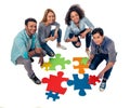 Young people with puzzles Royalty Free Stock Photo