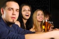 Young fashion people relaxing in a night bar Royalty Free Stock Photo