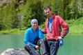 Young people are resting on trek in mountains Royalty Free Stock Photo