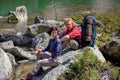 Young people are resting on trek in mountains Royalty Free Stock Photo