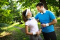 Young people running outdoors. Couple or friends of runners exercising in park Royalty Free Stock Photo