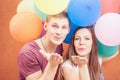 Young people sending a blow kiss to the camera