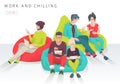 Young people sit on bean bag with different gadgets