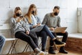 Young people sit together in masks Royalty Free Stock Photo