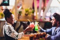 Young people sitting in a cafe and talking. Young man and woman meeting at cafe table. Royalty Free Stock Photo