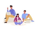 Young people sitting in difference pose on square block or on the floor using laptop for work or study. Coworking, teamwork, Royalty Free Stock Photo