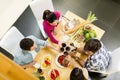 Young people sitting by the table