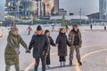 Young people skating at ice rink. Winter entertainment concept