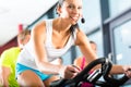 Young People Spinning in the fitness gym Royalty Free Stock Photo