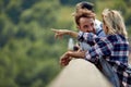 Young people is standing on a bridge and enjoys the view Royalty Free Stock Photo