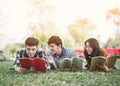 Young people studying reading book in park. education study by read. Royalty Free Stock Photo