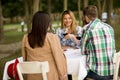 Young people by the table in the vineyard Royalty Free Stock Photo