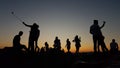 Young people taking selfies in the sunset