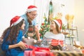 Young people talking with smiles in christmas party