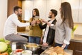 Young people toasting with white wine Royalty Free Stock Photo