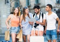 Young people tourists searching for direction using paper map Royalty Free Stock Photo