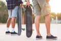 Young people training with longboard - Skaters friends outdoor in urban city context with skateboards  - Extreme sport and Royalty Free Stock Photo