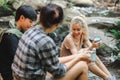 Young People Trekking Group Holding the Camping Water Cup is Clean Water for Drink. Hikers\' Refreshment Break