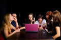 Young people using laptop in a night bar Royalty Free Stock Photo