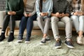 Young people using mobile phones on sofa. Concept of addiction Royalty Free Stock Photo