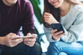 Young people using and playing games on mobile phone together Royalty Free Stock Photo