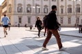 Young people walking in center of Milan with and without masks during covid outbreak. Milan, Italy - September 27, 2020 Royalty Free Stock Photo